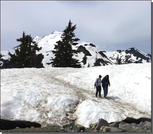 Megan helping her dad off the snow pack - he had just fallen.