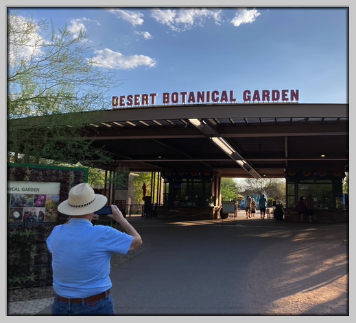 Entrance to the Desert Botanical Garden, Dave taking a picture.